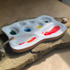 close up of 8 pan organic, handmade ceramic palette for mixing watercolor paints made by busy hands studio