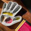 hand made, ceramic palette, modeled after the hand of the artist that made the watercolor mixing palette