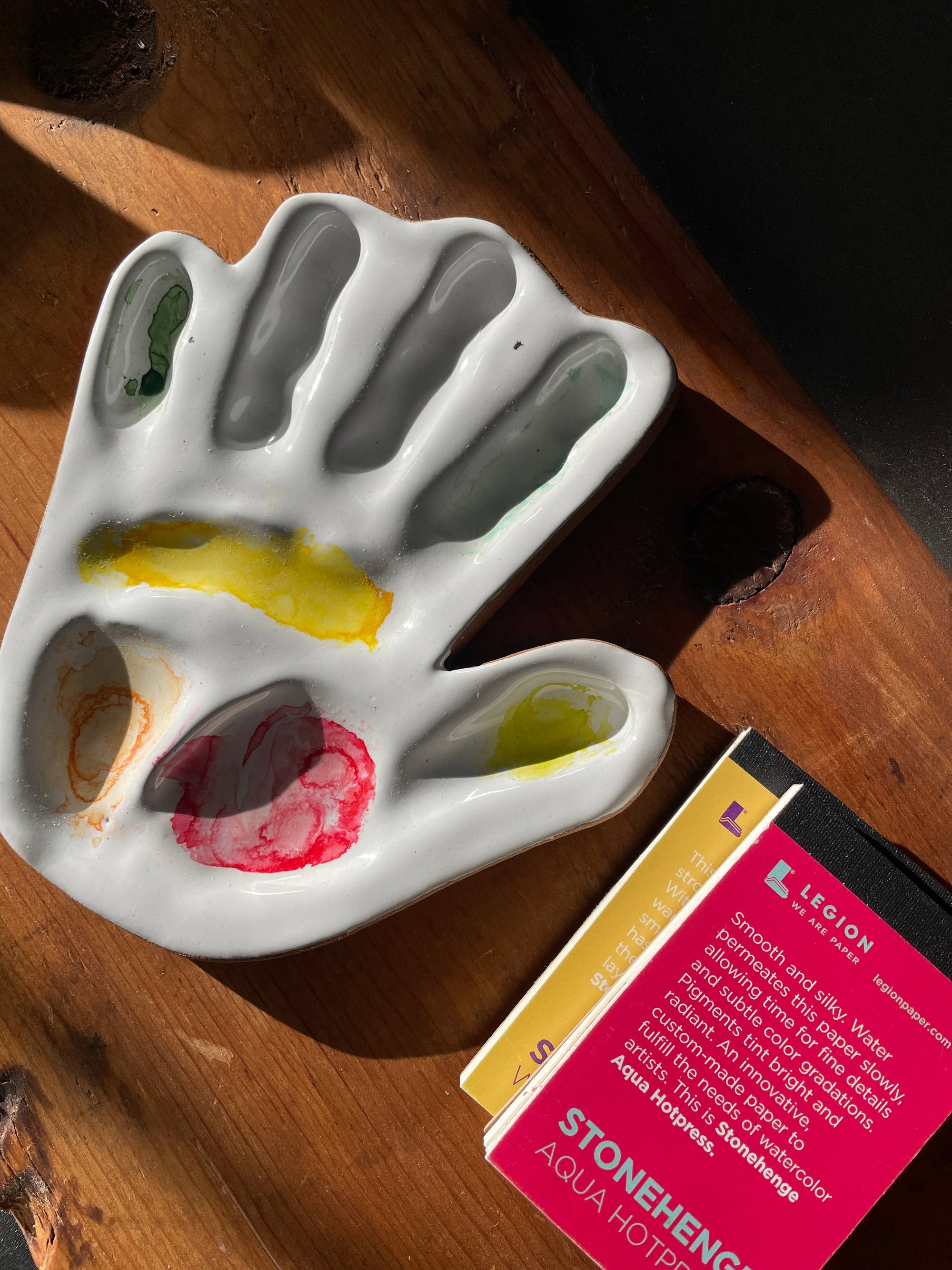 hand made, ceramic palette, modeled after the hand of the artist that made the watercolor mixing palette