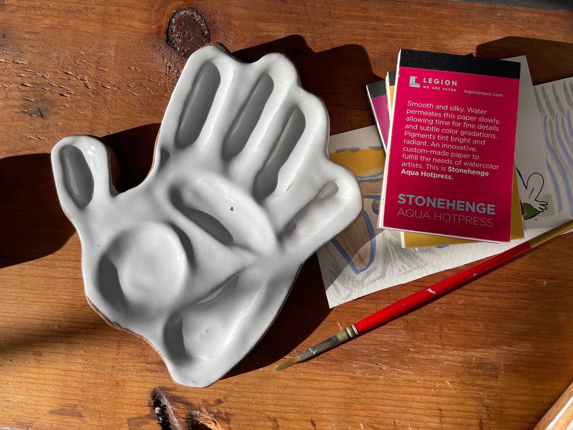 hand made, ceramic palette, modeled after the hand of the artist that made the watercolor mixing palette